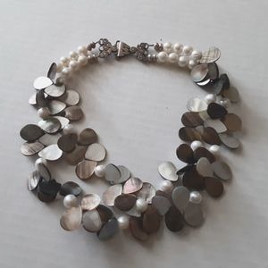Pearl and mother of pearl necklace with sterling silver clasp.